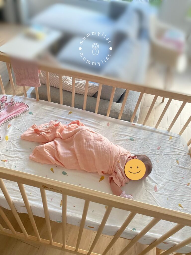 Baby sleeping soundly in the living room in her Beblum Lavo 5 cot